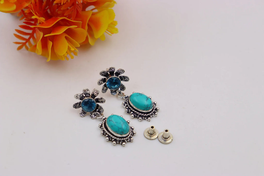 Boucles d'oreilles en turquoise et topaze bleue